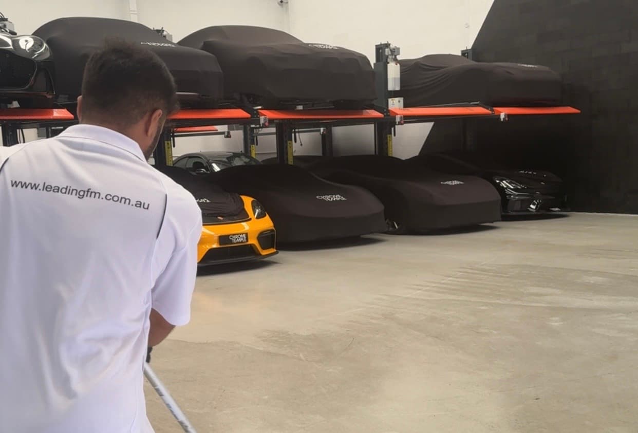 Leading FM cleaner vacuuming a retail showroom