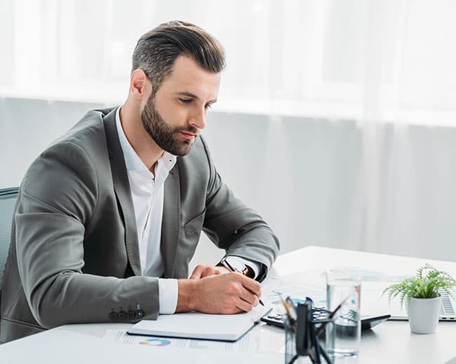 Facilities manager working at a desk
